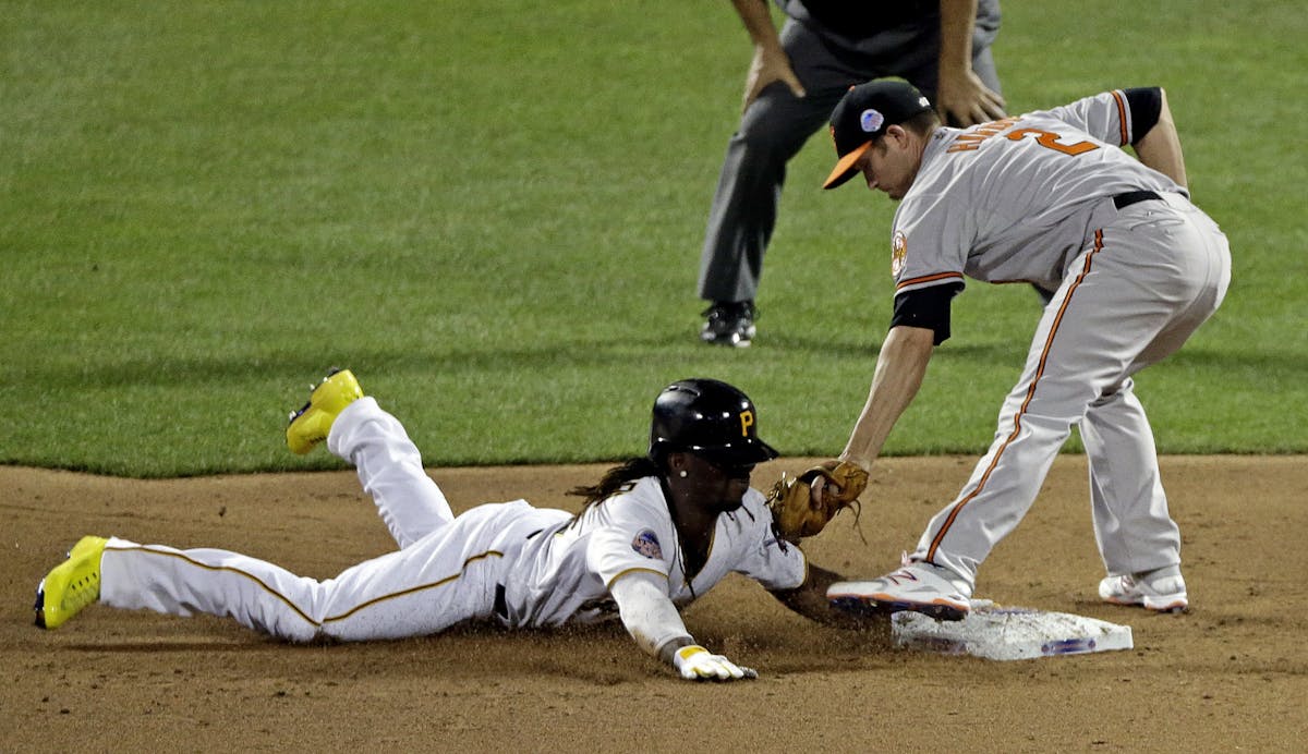 National League�s Andrew McCutchen, of the Pittsburgh Pirates, safely steals second under the tag of American League�s J.J. Hardy, of the Baltimor