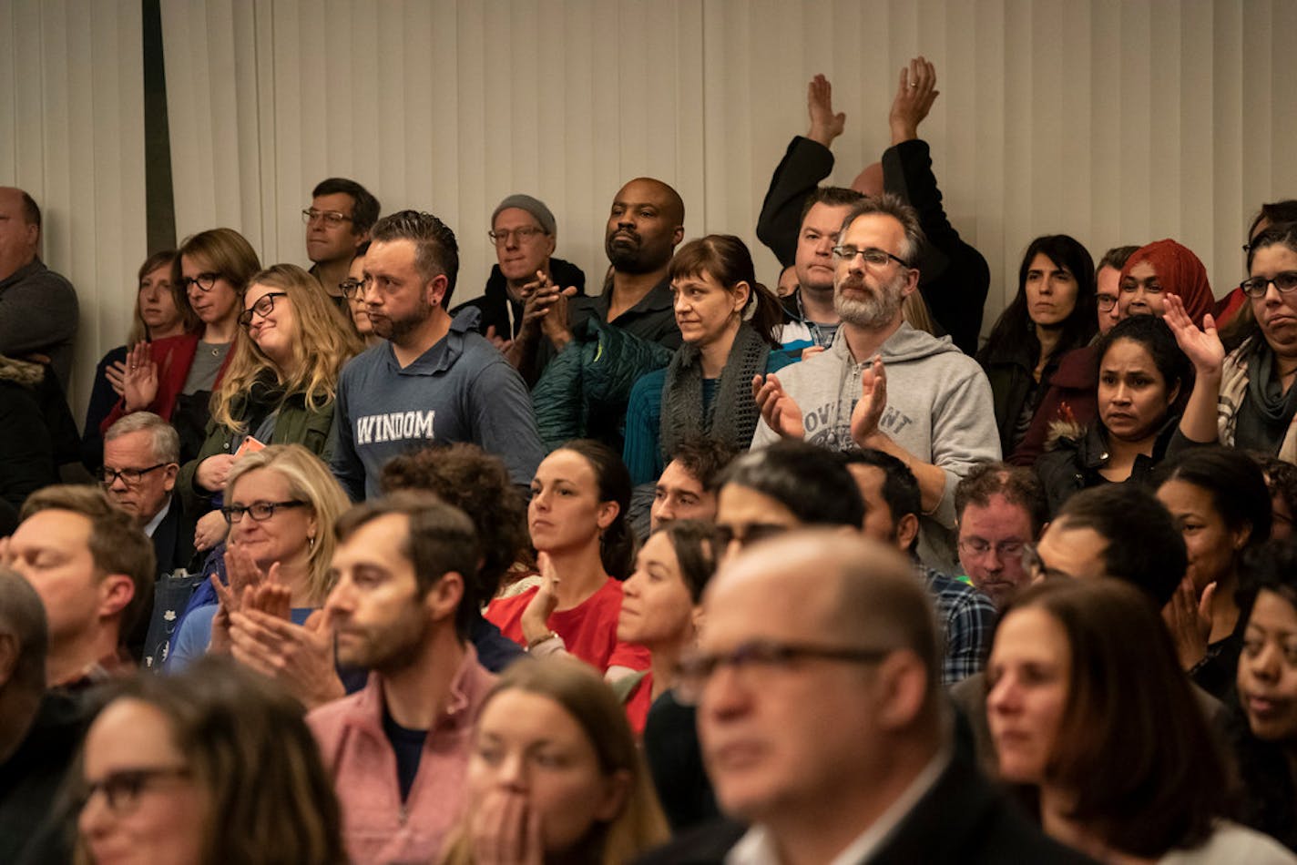 People stood in the back of the room when an overflow crowd attended the Minneapolis School Board meeting in Minneapolis, Tuesday, Jan. 14, 2020. Many parents attended to voice their concerns about the district's strategic plan.