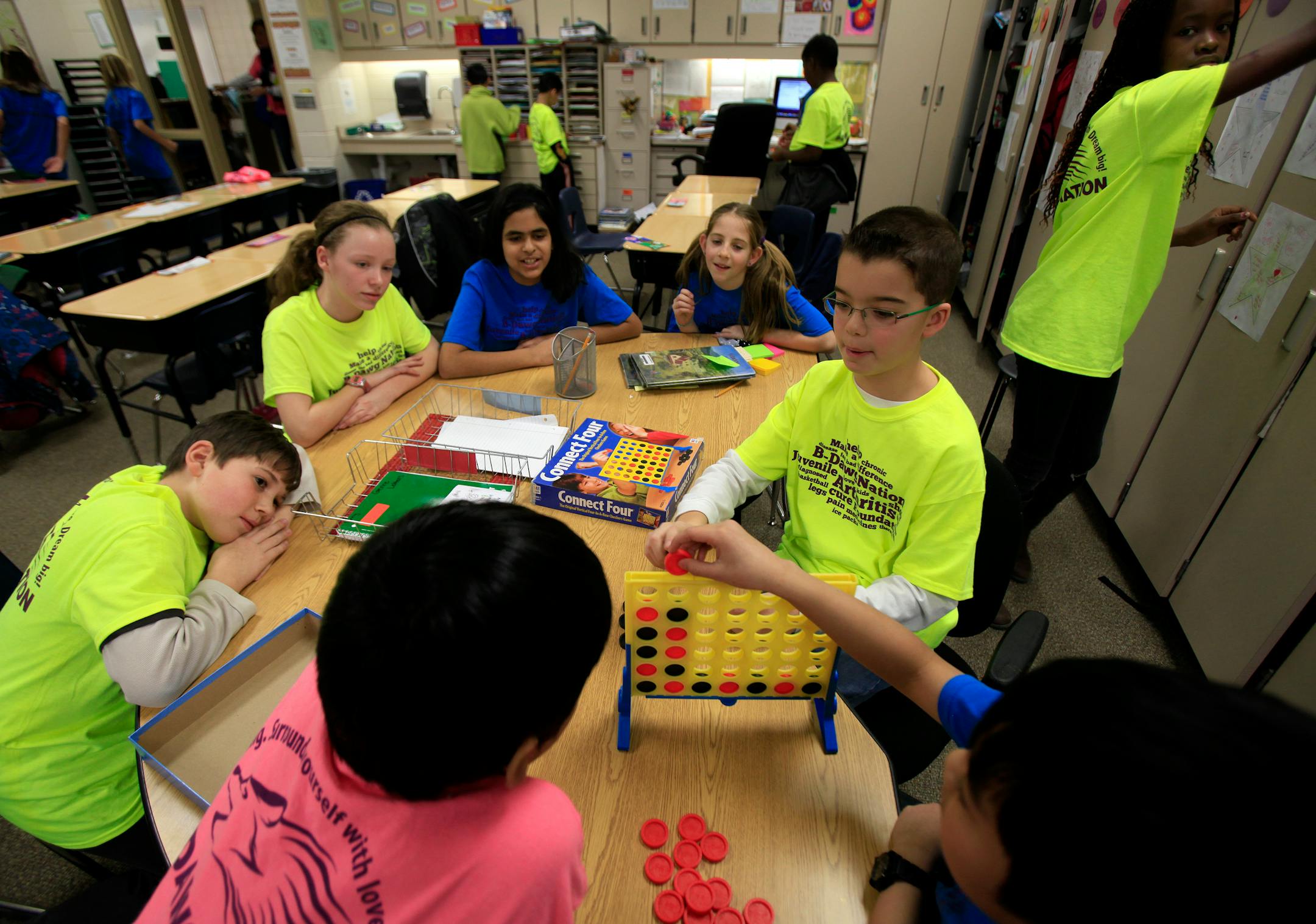 Jarrett Michie, 10, plays Connect Four with classmates at Diamond Path School in Apple Valley, MN on January 23, 2013.