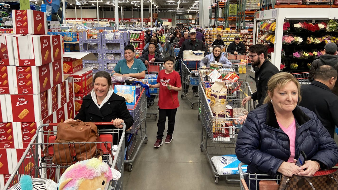 Shoppers flooded Costco causing a check-out line stretching to the back of the store as they stocked up on household items in response to the Coronavirus, prompting a limit on toilet paper and bottled water, Friday in Maple Grove, Minn. ] ANTHONY SOUFFLE &#x2022; anthony.souffle@startribune.com Shoppers flooded Costco stocking up on household items in response to the Coronavirus, prompting a limit on toilet paper and bottled water, Friday, March 13, 2020 in Maple Grove, Minn.