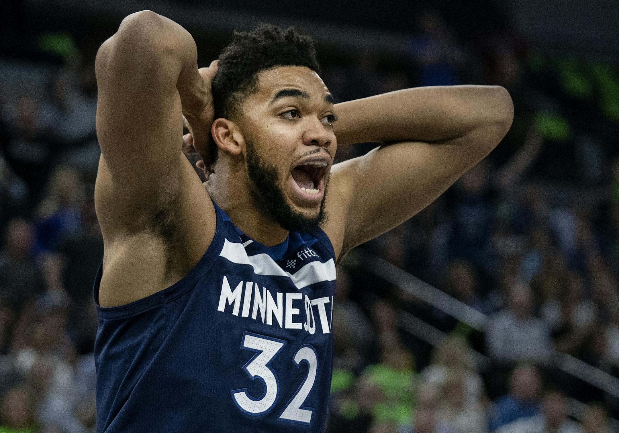 Minnesota Timberwolves Karl-Anthony Towns (32) reacted a call in the first quarter.