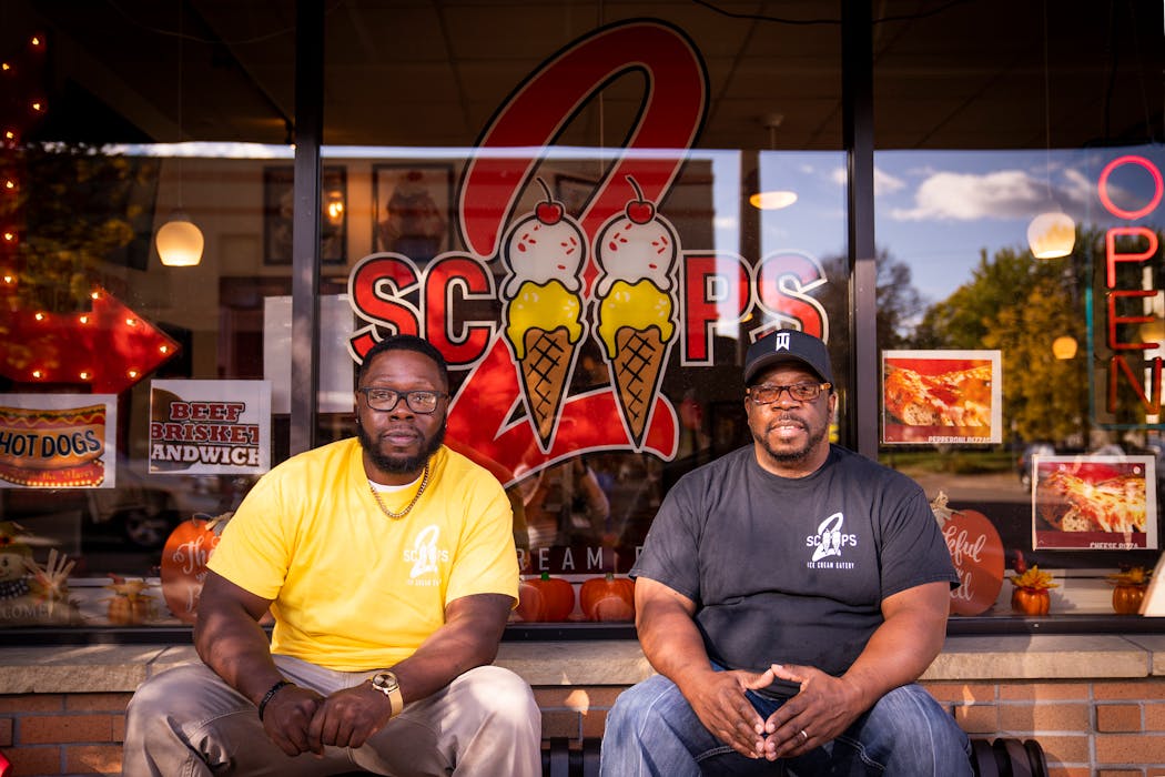 2 Scoops Ice Cream Eatery co-owners Brian White Sr., right, and Brian White Jr. outside their St. Paul shop.