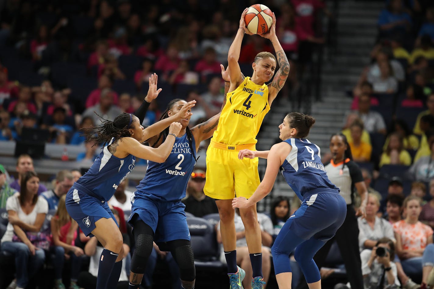 Indiana Fever's Candice Dupree pulls down a rebound over Minnesota Lynx defenders Erlana Larkins, left, and Cecilia Zandalasini on Wednesday, July 18, 2018 at Target Center in Minneapolis, Minn. The Minnesota Lynx beat the Indiana Fever, 89-65. (Jerry Holt/Minneapolis Star Tribune/TNS) ORG XMIT: 1236074