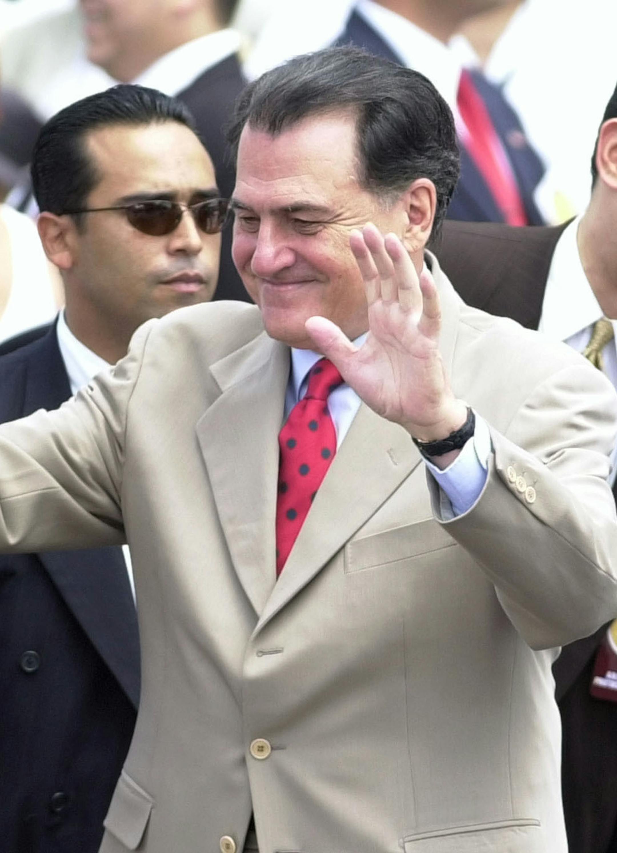 FILE - In this July 25, 2002 file photo, former Puerto Rican Gov. Rafael Hernández Colón waves to the crowd during a celebration at the Capitol in San Juan, Puerto Rico. Hernández Colón, who oversaw one of the U.S. territory's most prosperous periods, died on Thursday, May 2, 2019. He was 82. (AP Photo/Lynne Sladky, File)