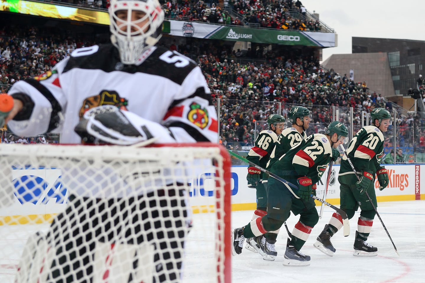 Wild players celebrated a goal by right winger Nino Niederreiter (22) as Blackhawks goalie Corey Crawford returned to the net in the second period of Minnesota's 6-1 victory at TCF Bank Stadium on Sunday.