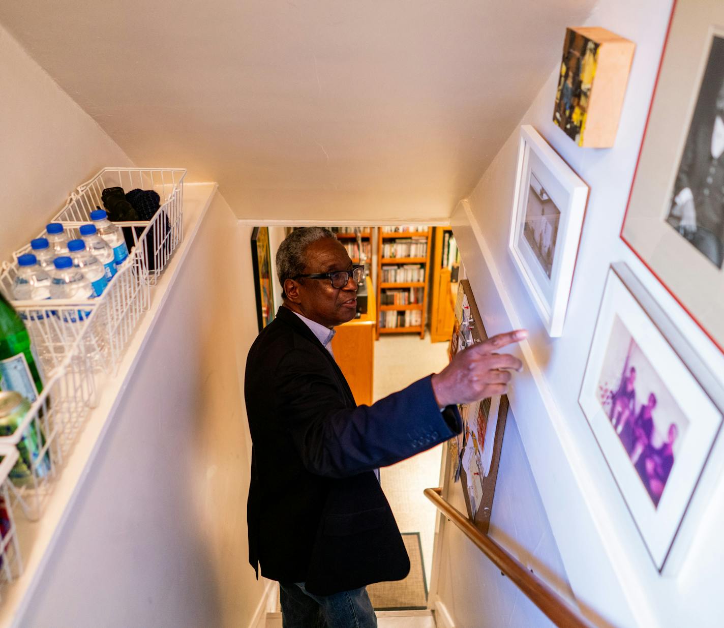 Herman Milligan points out print by Newsweek photographer Bill Davis, part of his extensive collection of art with Minnesota ties. ] MARK VANCLEAVE &#x2022; mark.vancleave@startribune.com * Herman Milligan poses for a portrait in his Minneapolis home Friday, Oct. 19, 2018.