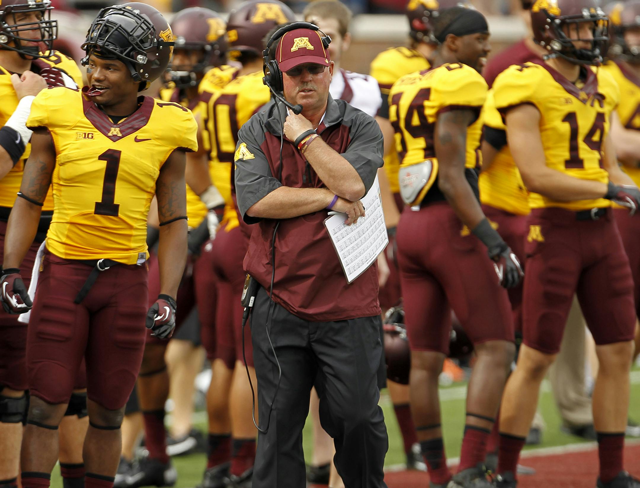 Gophers coach Jerry Kill walked the sideline during the first quarter against Western Illinois on Saturday. Kill suffered a seizure at halftime and did not coach in the second half.