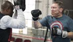 Carl Luepker, right, works out at Uppercut Boxing Gym with trainer Seko Tongola. ] (Leila Navidi/Star Tribune) leila.navidi@startribune.com BACKGROUND