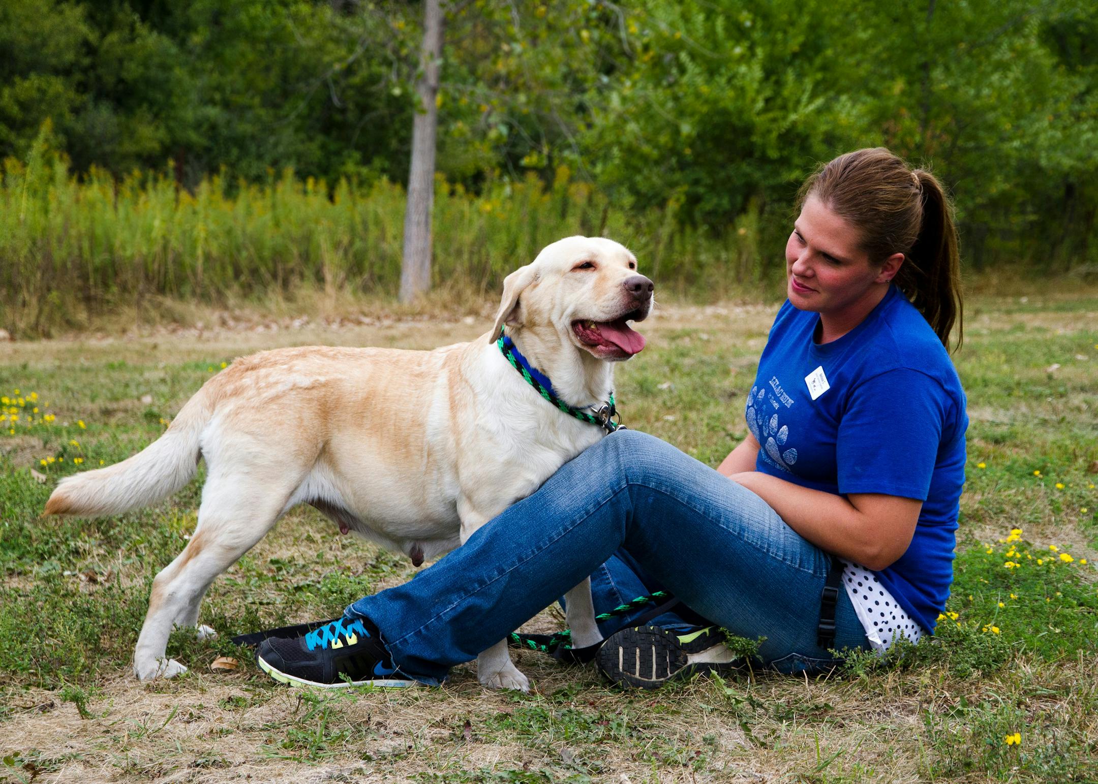 Melissa Carlson with one of the dogs going up for adoption.