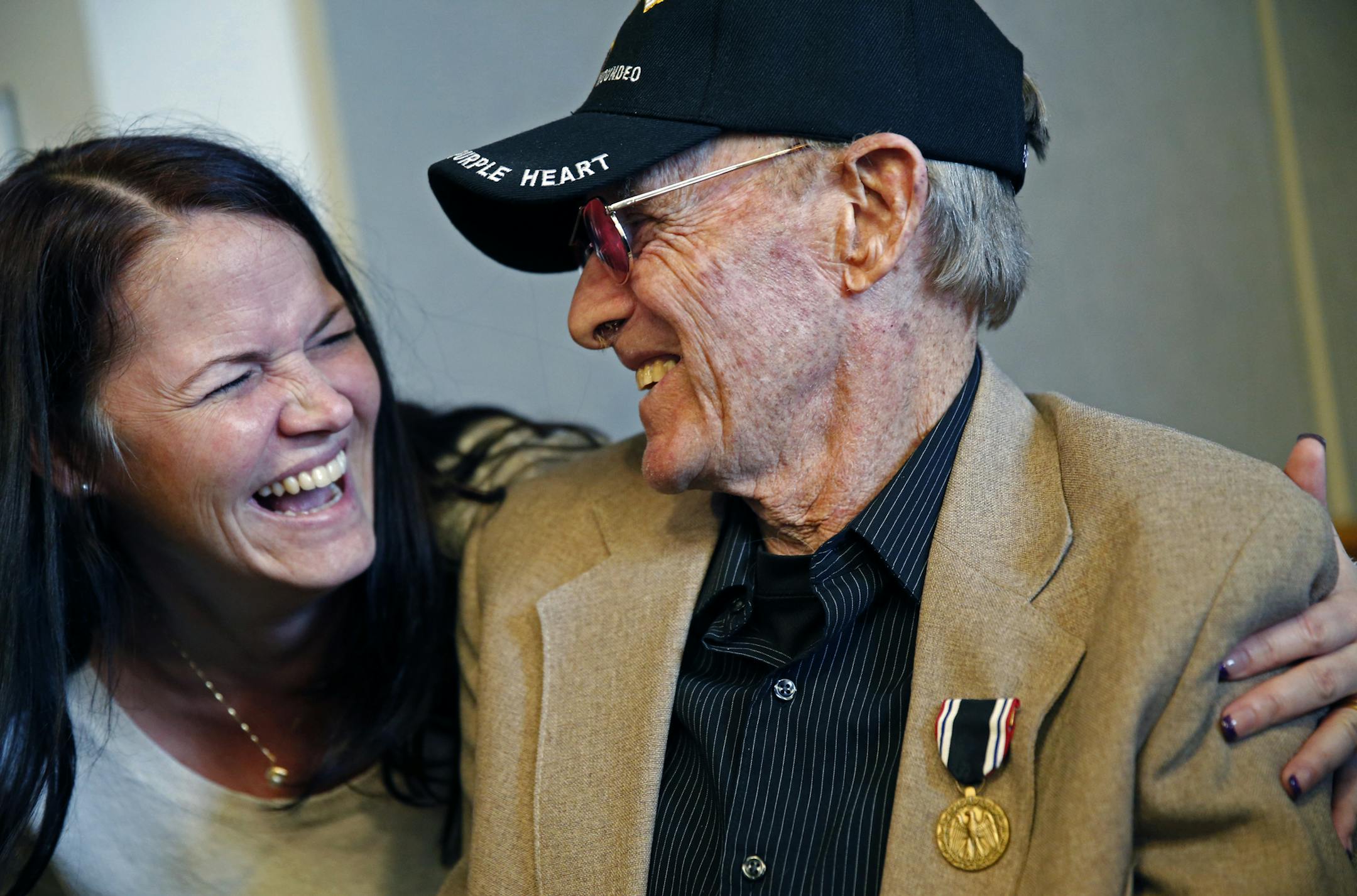 At the State Capitol Senator Al Franken presented a Prisoner of War service medal to Duane Brothen, 80 who was left for dead in the trenches by the North Korean forces and escaped five days later when he gained enough strength from his twenty plus injuries. His Niece Anna Winter had a big smile as Brothen gave her some grief.]rtsong-taatarii@startribune.com