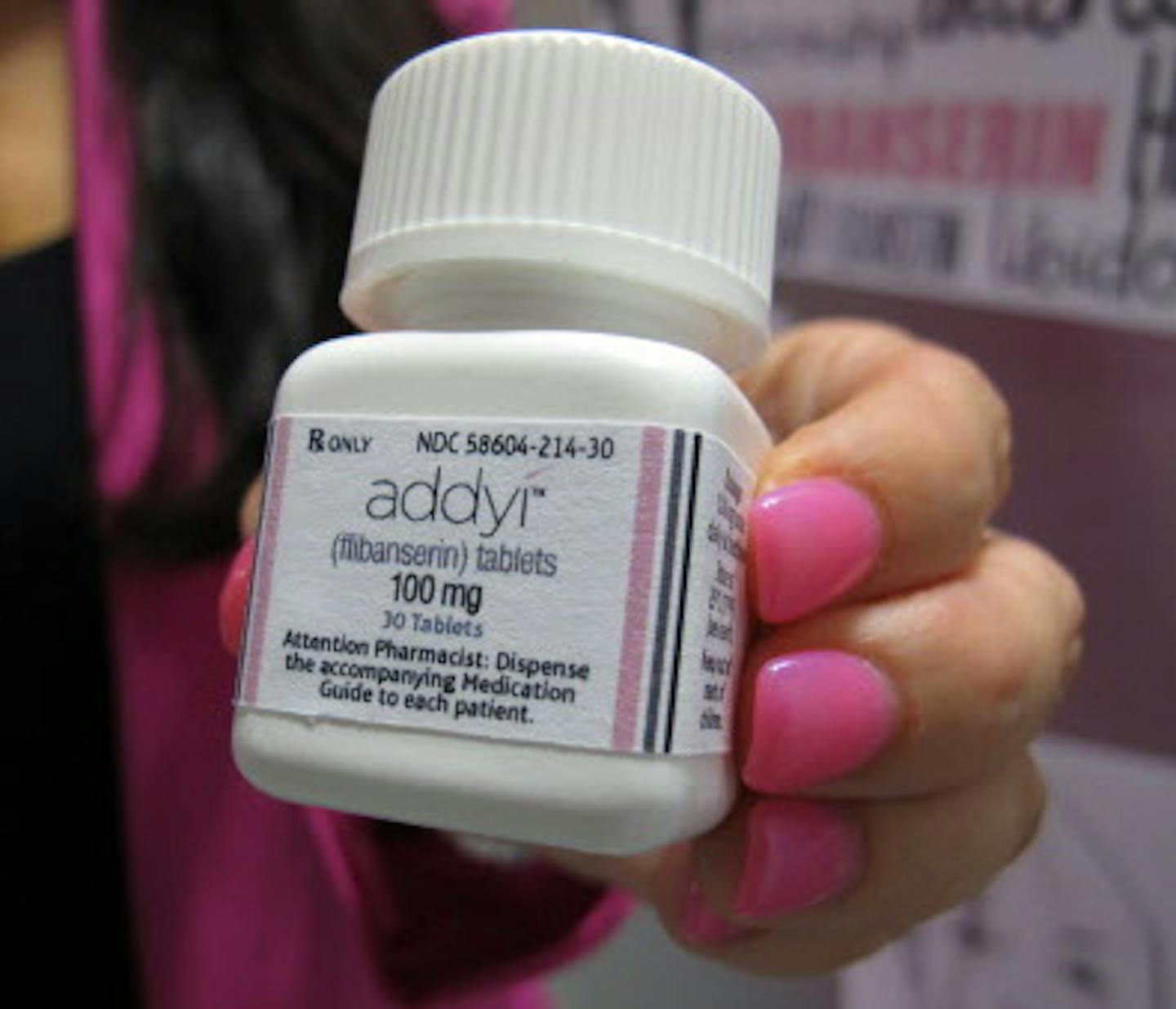 CORRECTS DATE WHEN PHOTO WAS TAKEN FROM AUG. 15, 2015, TO AUG. 18, 2015 - FILE - In this Aug. 18, 2015 file photo, Sprout Pharmaceuticals CEO Cindy Whitehead holds a bottle for the female sex-drive drug Addyi at her Raleigh, N.C. Valeant Pharmaceuticals will pay about $1 billion to buy Sprout Pharmaceuticals. The deal Thursday, Aug. 20, 2015, comes one day after regulators approved Addyi. Valeant expects the Sprout pill, Addyi, to be available in the United States in the fourth quarter. (AP Phot