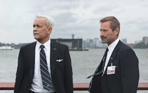 This image released by Warner Bros. Pictures shows Tom Hanks, left, and Aaron Eckhart in a scene from "Sully." (Warner Bros. Pictures via AP)