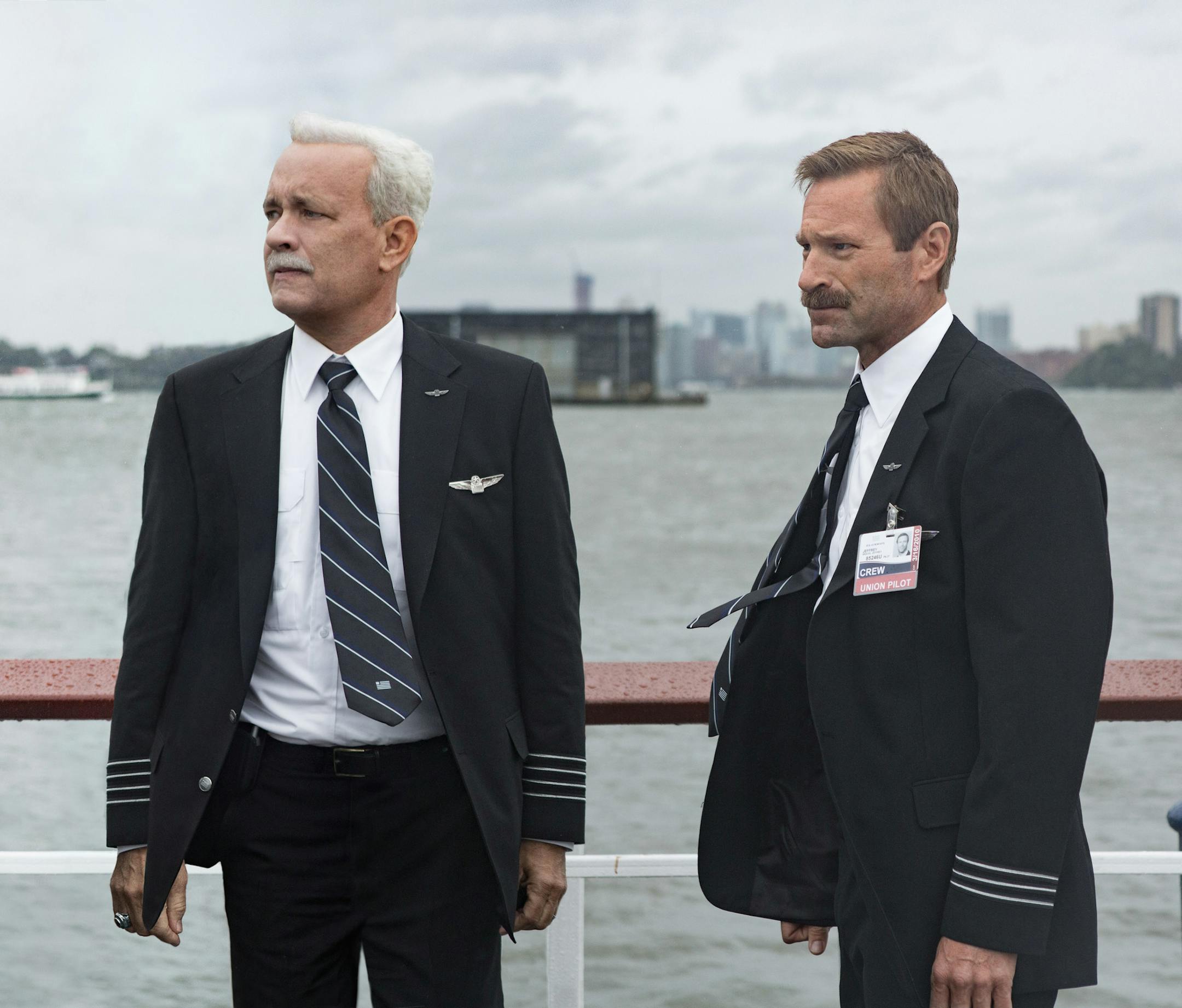 This image released by Warner Bros. Pictures shows Tom Hanks, left, and Aaron Eckhart in a scene from "Sully." (Warner Bros. Pictures via AP)