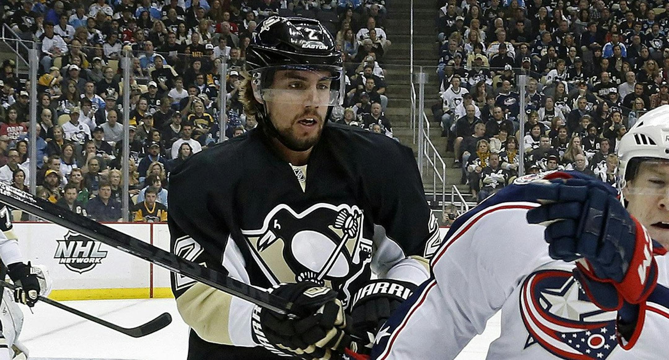 The Columbus Blue Jackets' Matt Calvert, right, and the Pittsburgh Penguins' Matt Niskanen battle for the puck during the first period in Game 5 of an Eastern Conference quarterfinal at Consol Energy Center in Pittsburgh on Saturday, April 26, 2014. (Kyle Robertson/Columbus Dispatch/MCT) ORG XMIT: 1152217