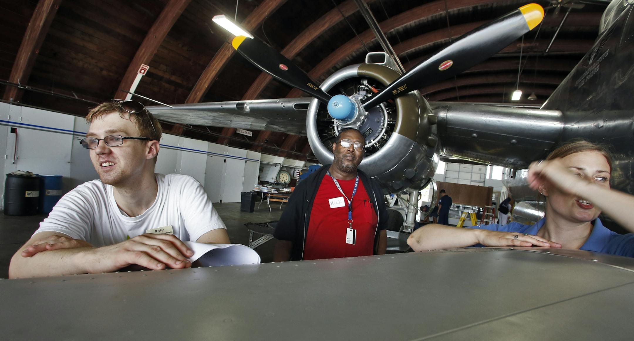 Genuine Genius is a program designed to promote the talents of people with autism. One of the individuals in the program is Ricky Whitmore, 25, who has an interest in aviation history. He recently led a group of men from the Veterans Home in Minneapolis in a tour through the Commemorative Air Force Museum in South St. Paul, reading from a prepared text as they viewed vintage war planes and vehicles. Whitmore, left, with veteran Mick Smith and museum wing leader Amy Lauria, l-r. (MARLIN LEVISON/S