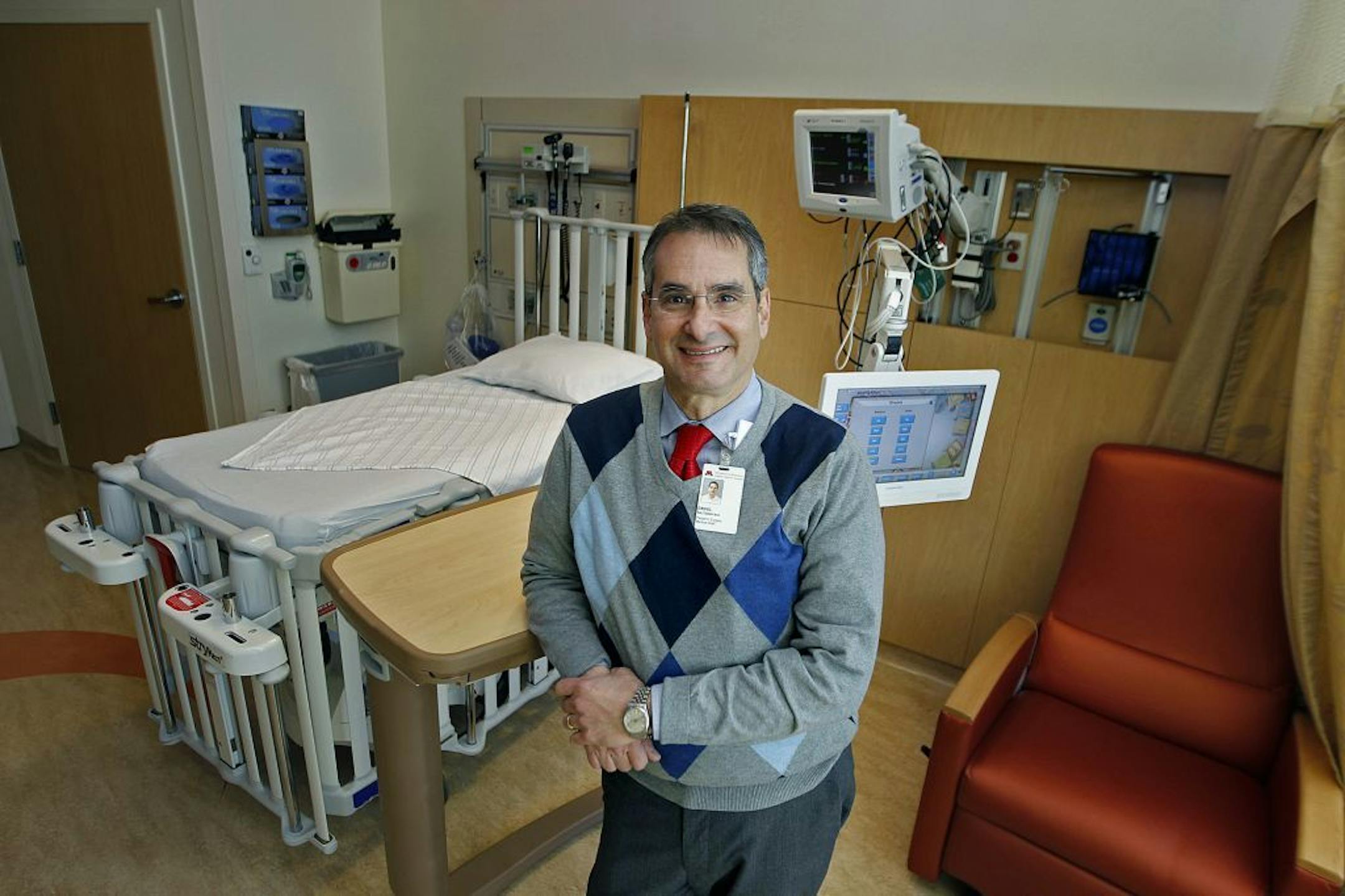 Dr. Daniel Saltzman says he can't afford to wait for Congress to restore funding for medical research, so he's turning to the public in an effort to raise $500,000. Saltzman, the chief of pediatric surgery at the University of Minnesota Medical School, says he needs the money to close a budget hole for the next two years in a study that could revolutionize cancer treatments by using genetically altered salmonella bacteria to deliver drugs directly to tumors. (ELIZABETH FLORES/STAR TRIBUNE) ELIZA