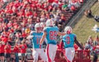 St. John’s wide receiver Jimmy Buck (11) celebrates with tight end Alec Ganz (89) following Ganz’s 57-yard touchdown reception in the Johnnies’ 