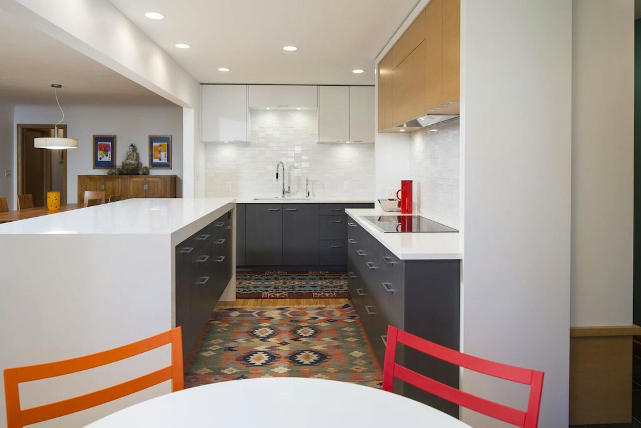 AFTER Higher cabinets and island top is a better fit for the tall homeowners.