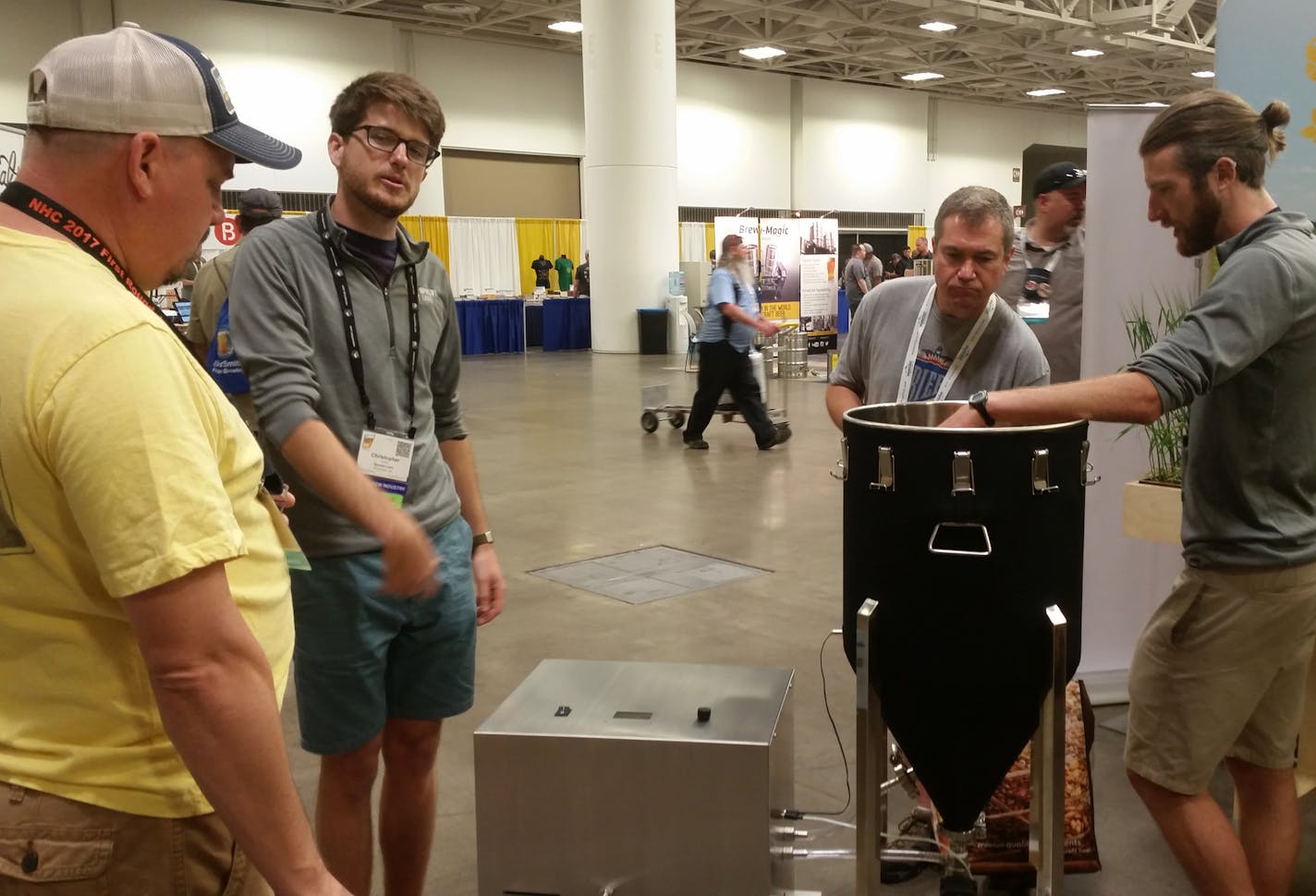 Christopher Abbott, middle left, and Mark Emmons, far right, of Sprowtlabs talked about their device at the National Homebrew Conference.