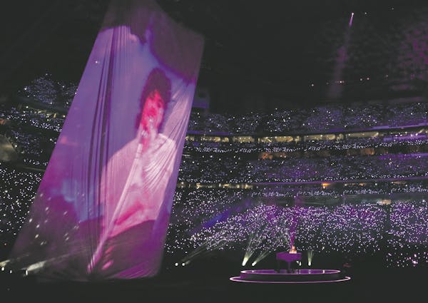 Accompanied by a huge projection of Prince, Justin Timberlake played the piano and sang during the halftime show at Super Bowl LII at U.S. Bank Stadiu