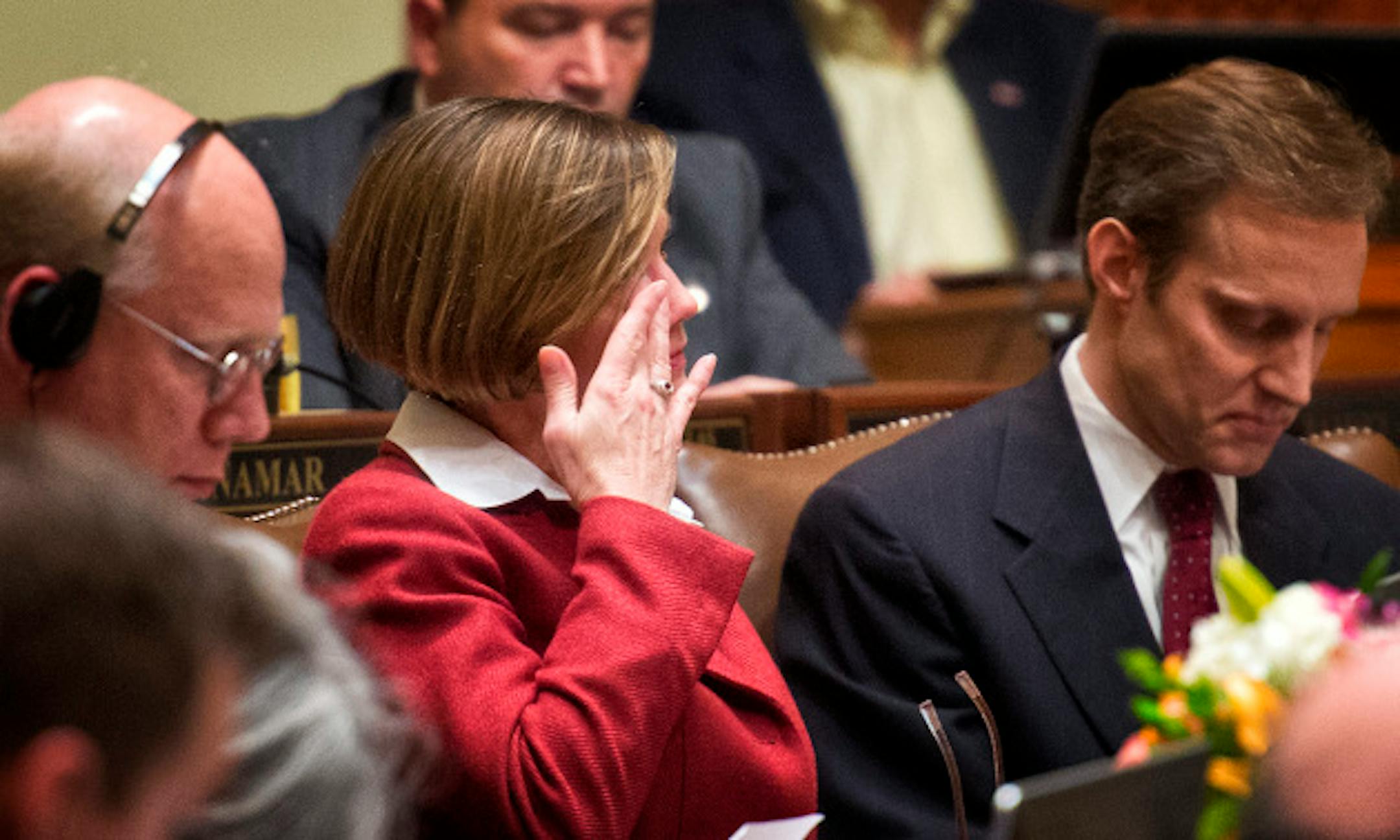 Rep. Kim Norton, DFL-Rochester wiped tears from her eyes after colleague Rep, Steve Simon, right, gave an emotion-filled speech from the House floor.   Thursday, May 9, 2013.     ]   GLEN STUBBE * gstubbe@startribune.com
