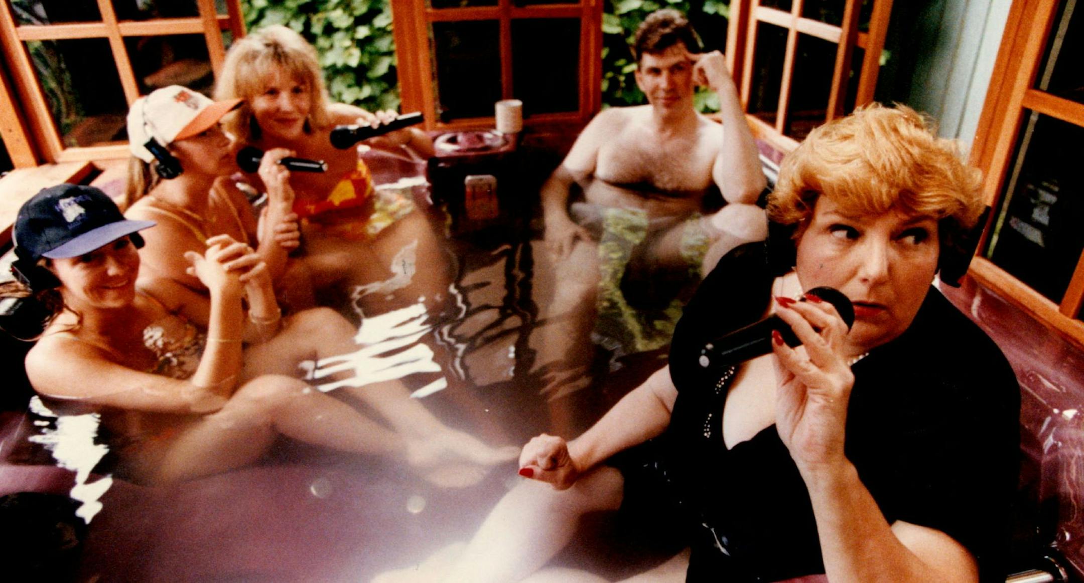 July 15, 1993 Barbara Carlson, morning talk show host (ess) os KSTP Talk radio does her thing in her hot tub at her home with women from HOOTERS, the restaurant and bar located in Bloomington MN. that is embroiled in a sexual harrassment suit. These women are from the other side and say they nave not experienced any harassment of any kind....left to right they are: Lisa, Steoganie and Shellie, the middle man is: Steve LaBeau, morning newsman for KSTP talk radio. July 20, 1993 Stormi Greener , Mi