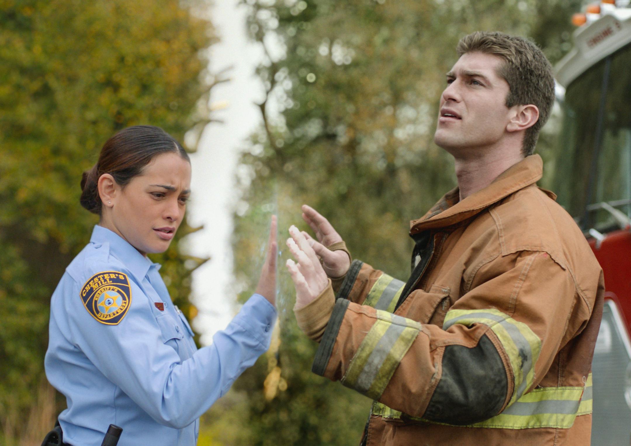 UNDER THE DOME: Deputy Linda (Natalie Martinez, left) and her fianc&#x221a;&#xc9;&#xac;&#xc9;&#x221a;&#xc7;&#xac;&#xa9;, Rusty (Josh Carter), find themselves separated by a massive transparent dome that&#x221a;&#xc9;&#xac;&#xa2;&#x221a;&#xc7;&#xac;&#xc4;&#x221a;&#xc7;&#xac;&#xf4;s suddenly fallen on the town of Chester&#x221a;&#xc9;&#xac;&#xa2;&#x221a;&#xc7;&#xac;&#xc4;&#x221a;&#xc7;&#xac;&#xf4;s Mill, on UDER THE DOME premiering Monday, June 24 (10:00-11:00 PM, ET/PT) on CBS. UNDER THE DOME is