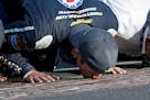 Kasey Kahne kisses the yard of bricks on the start/finish line after winning last year's Brickyard 400. He will not race in this year's event.