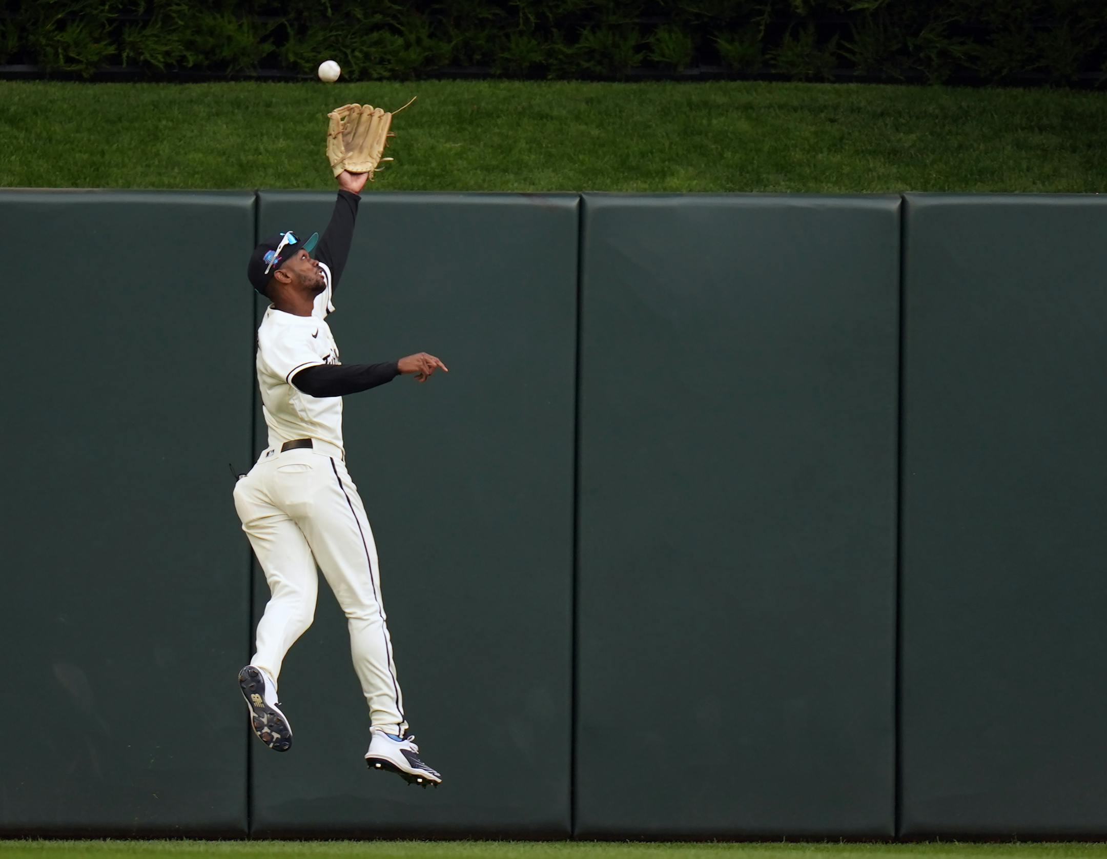 Minnesota Twins center fielder Michael A. Taylor (2) misses the ball on a triple by Detroit Tigers right fielder Jake Marisnick (15 )in the fifth inning.