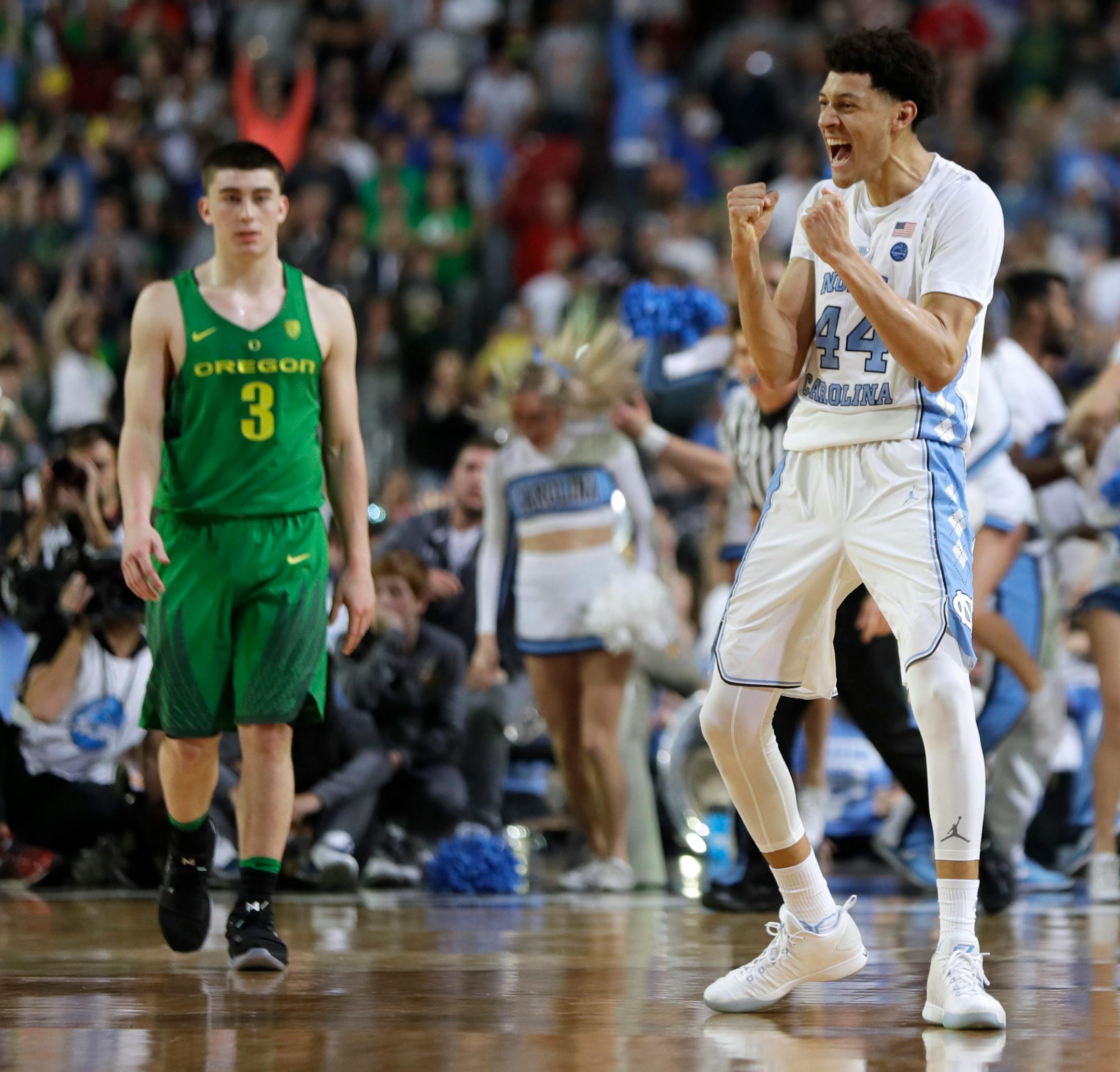 North Carolina forward Justin Jackson (44) celebrates in front of Oregon guard Payton Pritchard (3) at the end of a semifinal in the Final Four NCAA college basketball tournament, Saturday, April 1, 2017, in Glendale, Ariz. North Carolina won 77-76. (AP Photo/Mark Humphrey)
