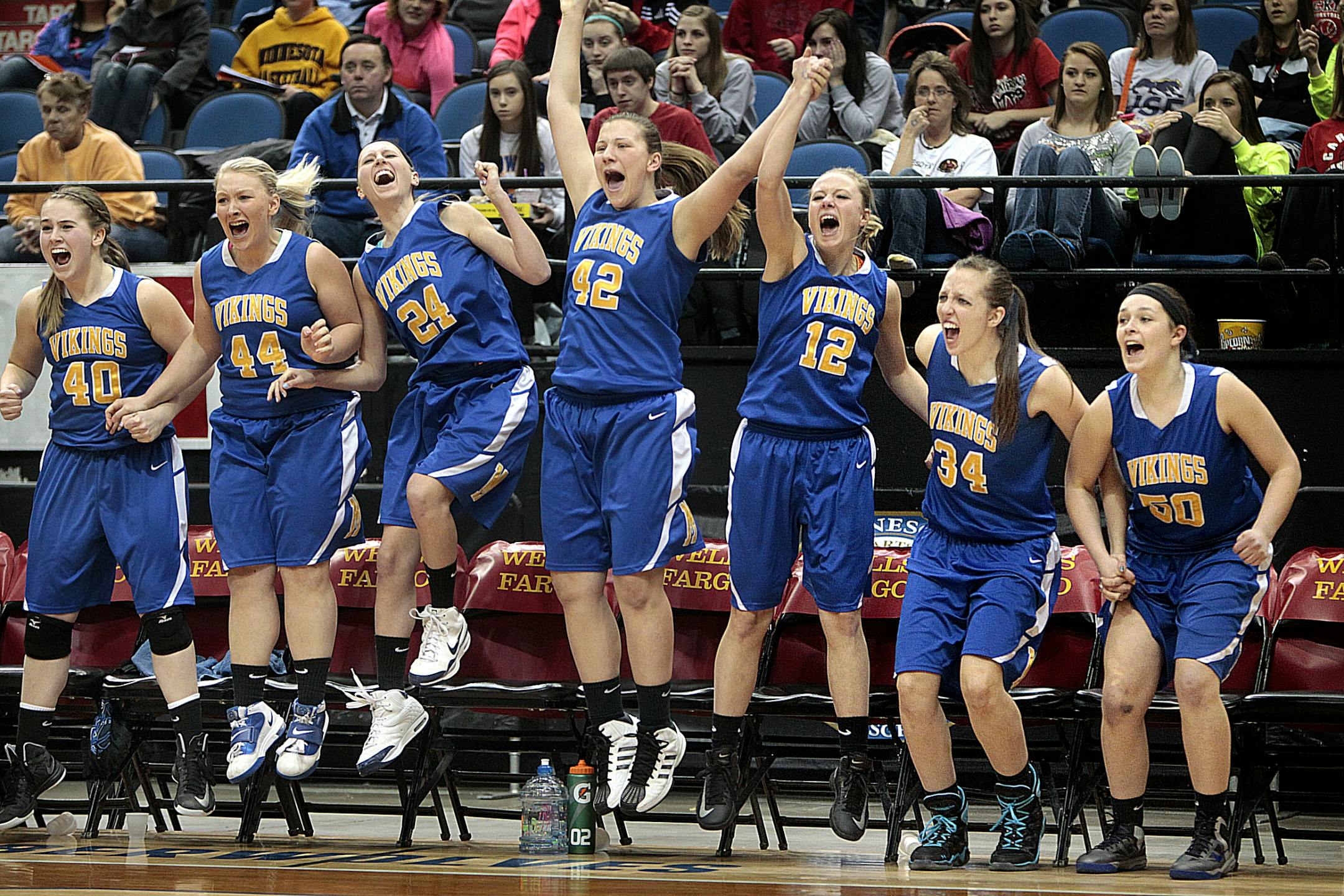 The Minneota bench was all smiles after the team's 47-44 victory over Bethlehem Academy.