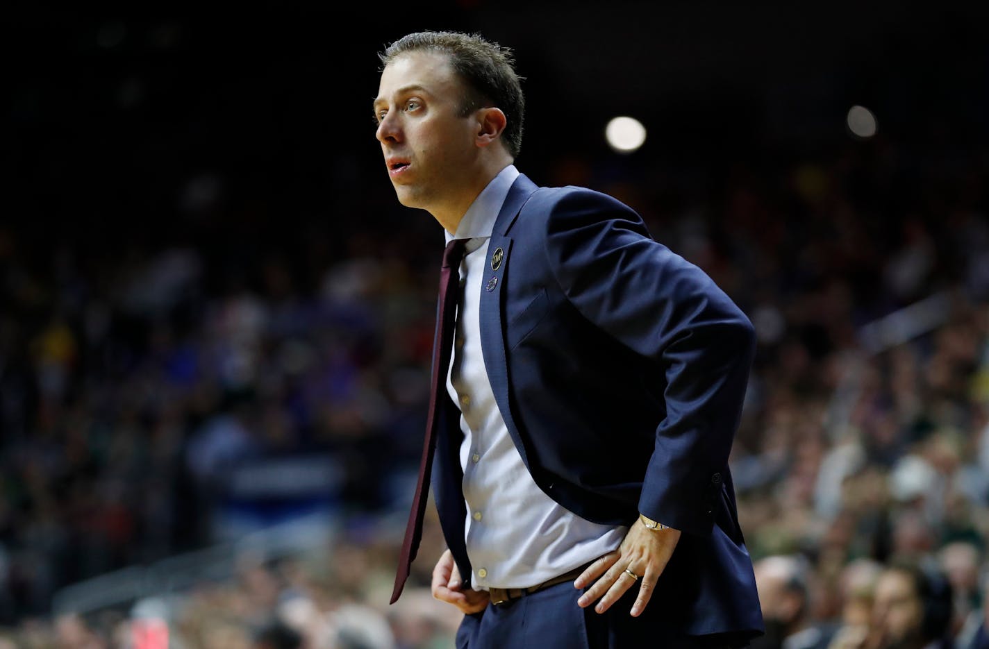 Minnesota head coach Richard Pitino watches from the bench during a second round men's college basketball game against Michigan State in the NCAA Tournament, Saturday, March 23, 2019, in Des Moines, Iowa. (AP Photo/Charlie Neibergall)