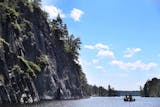 Fishermen float near the Grassy Bay Cliffs in Sand Point Lake in Voyageurs National Park.