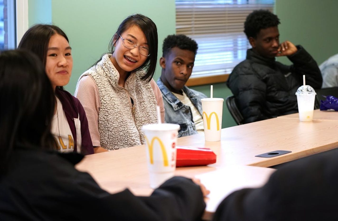 Rooselan Vang, from left, 17, Arianwen Yang, 14, Mahad Bile, 17, and Abdi Zibad, 18, participated a youth discussion about making cross cultural connections.