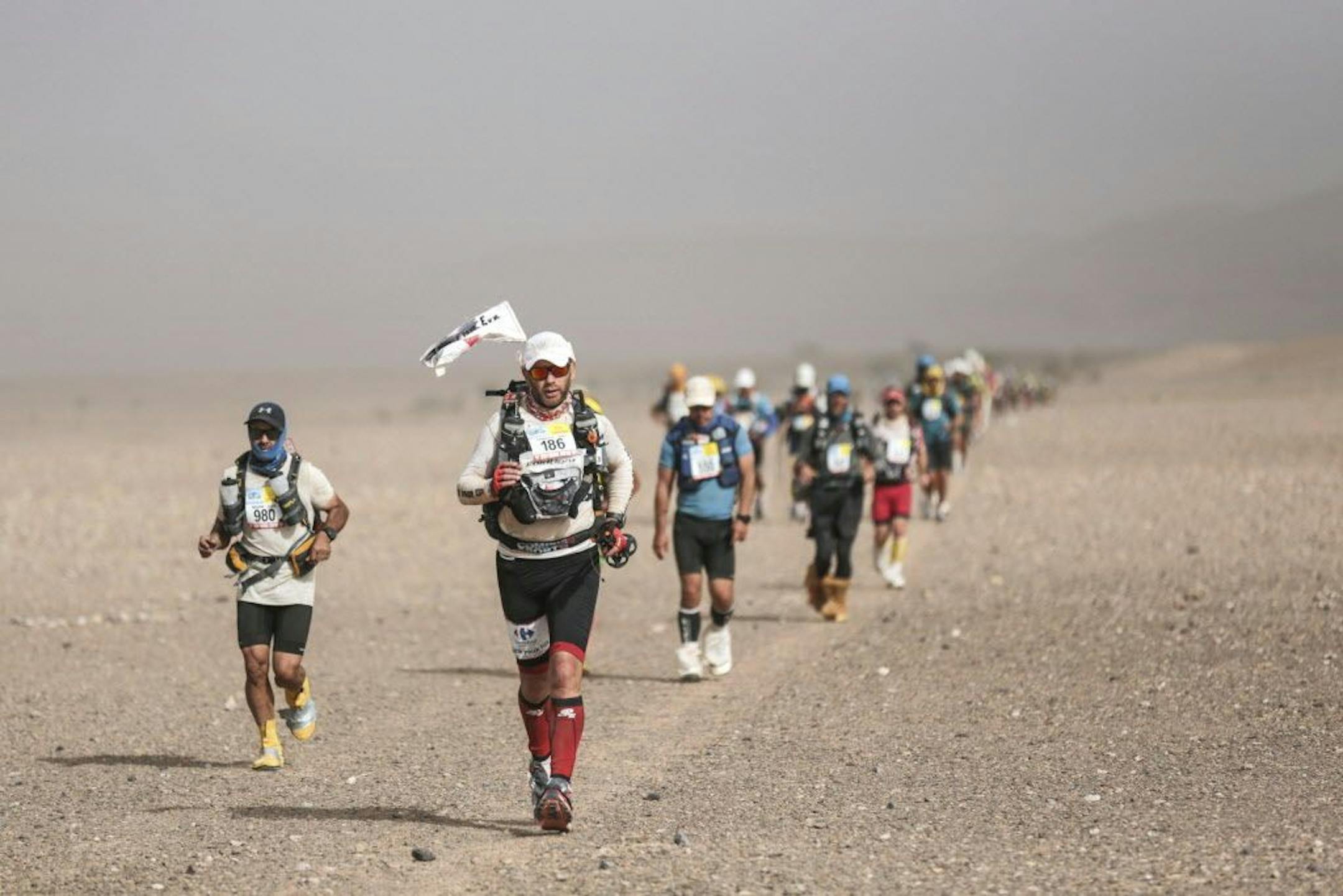 Competitors take part in stage 5 of the 33rd edition of Marathon des Sables, in the Sahara desert, near Merzouga, southern Morocco, Friday, April 13, 2018. The marathon, held every year in Morocco, is a 250-km ultra-trail that takes part over 6 stages in extremely grueling conditions.