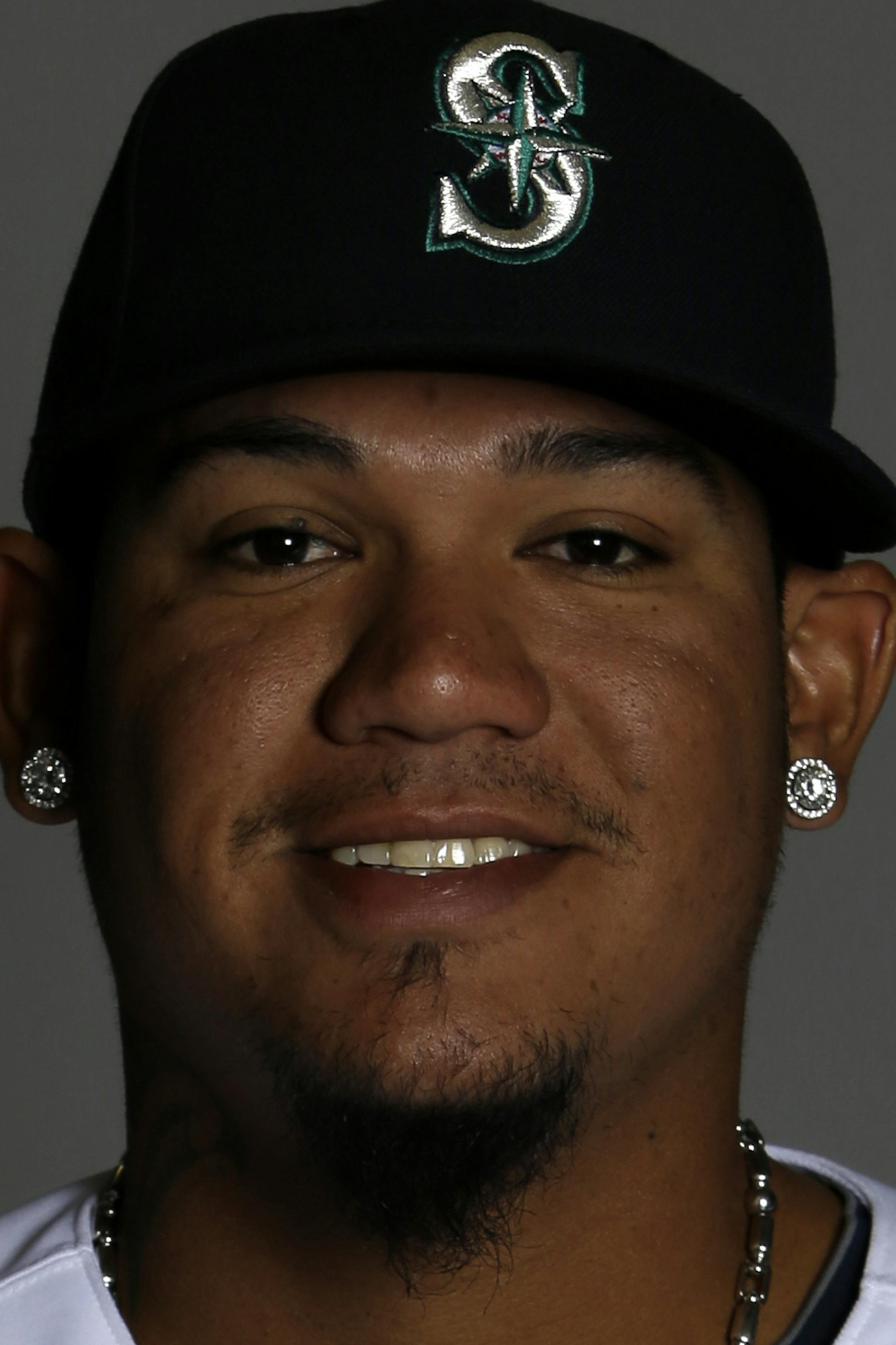 This is a 2014 photo of pitcher Felix Hernandez of the Seattle Mariners baseball team. This image reflects the Mariners active roster as of Thursday, Feb. 20, 2014, when this image was taken. (AP Photo/Tony Gutierrez) ORG XMIT: NYOTK