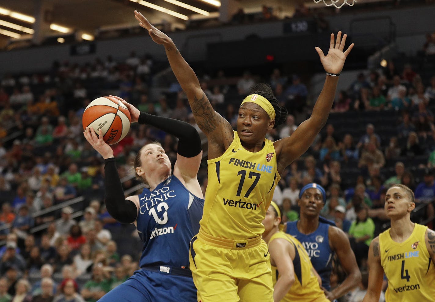 Minnesota Lynx's Lindsay Whalen scores over Indiana Fever's Erica Wheeler on Wednesday, July 18, 2018 at Target Center in Minneapolis, Minn. (Jerry Holt/Minneapolis Star Tribune/TNS) ORG XMIT: 1236074