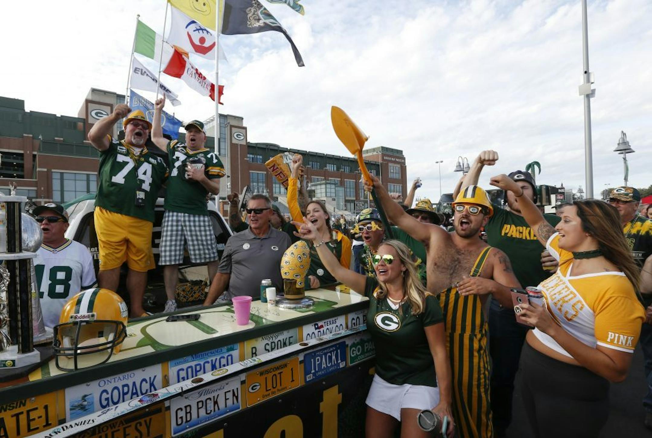 Fans tailgate before an NFL football game between the Green Bay Packers and the Chicago Bears Thursday, Sept. 28, 2017, in Green Bay, Wis.