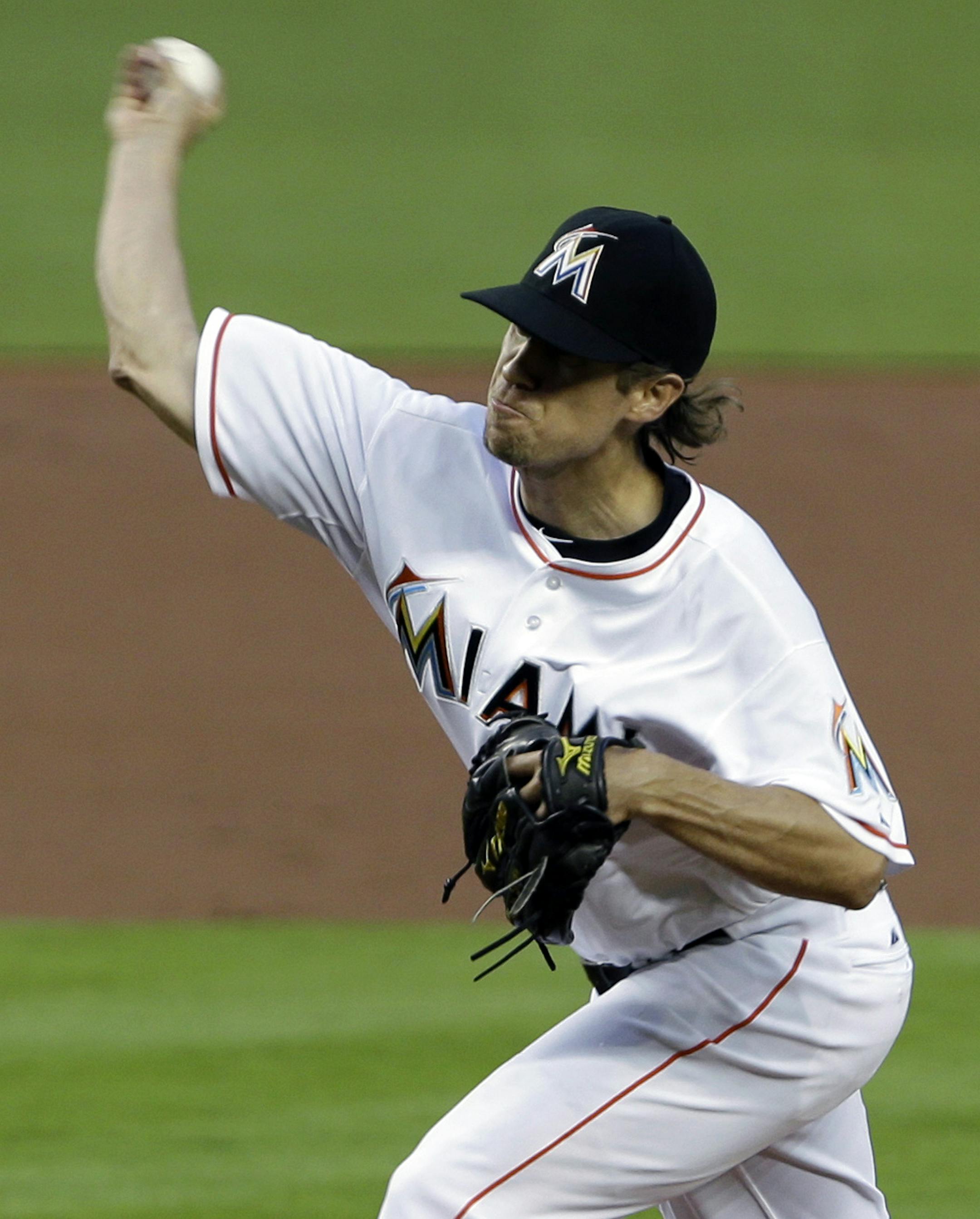 Miami Marlins' Kevin Slowey delivers a pitch during the first inning of a baseball game against the Atlanta Braves, Monday, April 8, 2013 in Miami. (AP Photo/Wilfredo Lee)