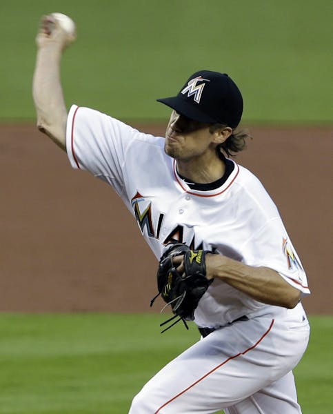Miami Marlins' Kevin Slowey delivers a pitch during the first inning of a baseball game against the Atlanta Braves, Monday, April 8, 2013 in Miami. (A
