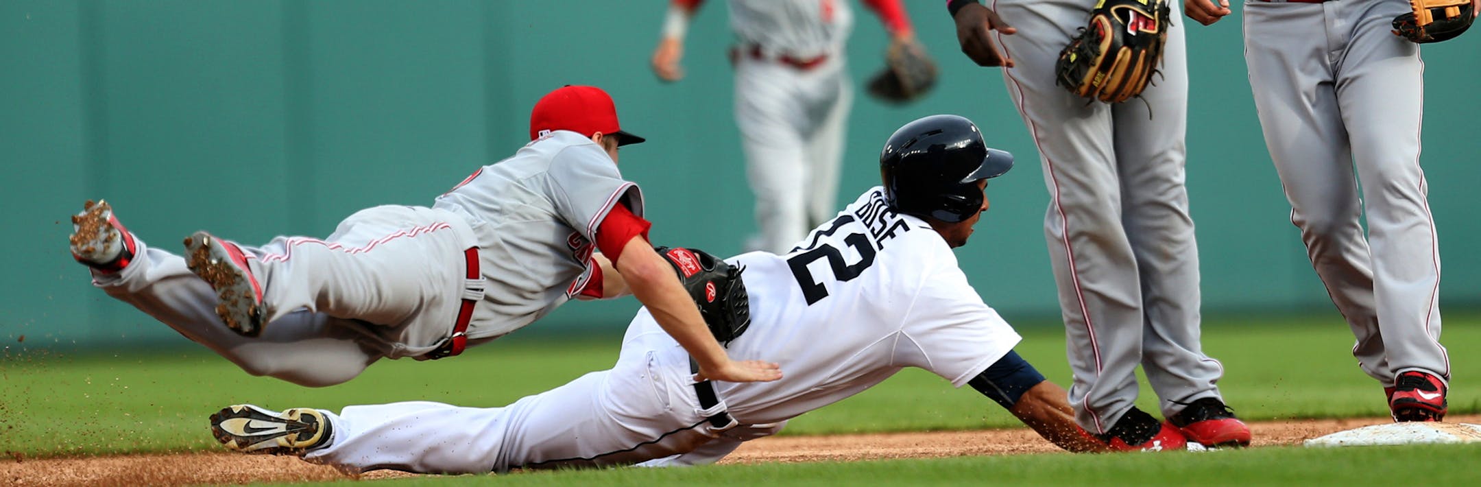 The Detroit Tigers' Anthony Gose is caught in a run down by the Cincinnati Reds' Jon Mascot, who was hurt on the play, during first inning action on Monday, June 15, 2015, at Comerica Park in Detroit. (Kirthmon F. Dozier/Detroit Free Press/TNS)