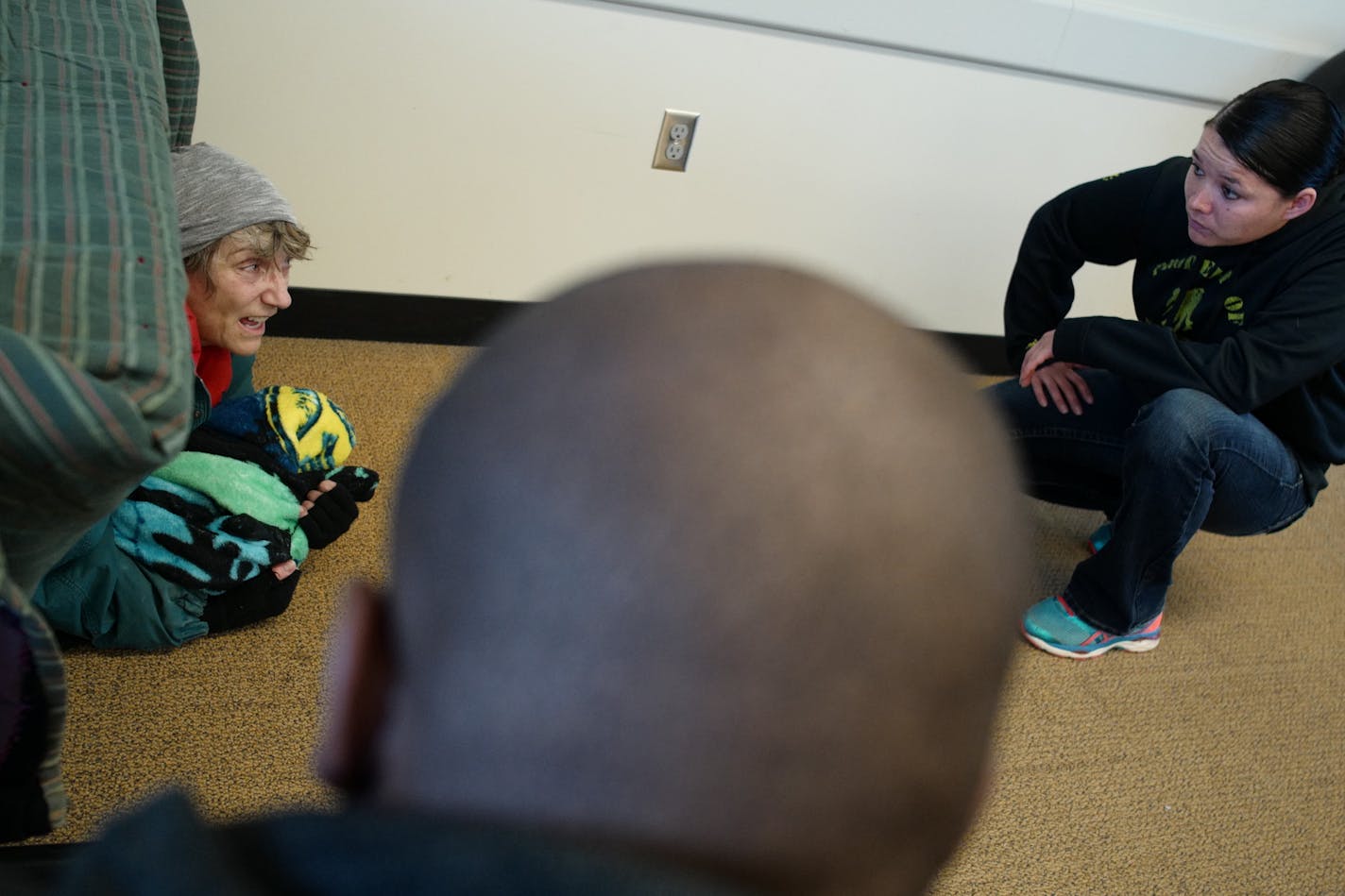 Officers Lamichael Shead and Jessica Stiffarm deal with a "homeless" person played by Hamline professor Carolyn Levy.]St. Paul police will partner with drama students at Hamline University Wednesday afternoon for Crisis Intervention Tream training in house. Richard Tsong-Taatarii&#xef;richard.tsong-taatarii@startribune.com