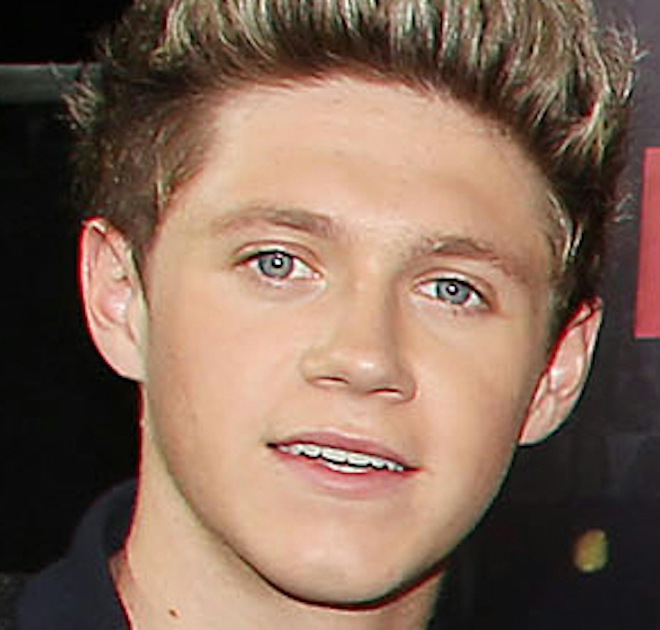 This image released by Starpix shows director Morgan Spurlock, second right, with members of One Direction, from left, Niall Horan, Louis Tomlinson, Zayn Malik, Harry Styles, and Liam Payne, right, at the premiere of the film "One Direction: This Is Us," at the Ziegfeld Theatre in New York on Monday, Aug. 26, 2013. (AP Photo/Starpix, Dave Allocca) ORG XMIT: MIN2013090313332869