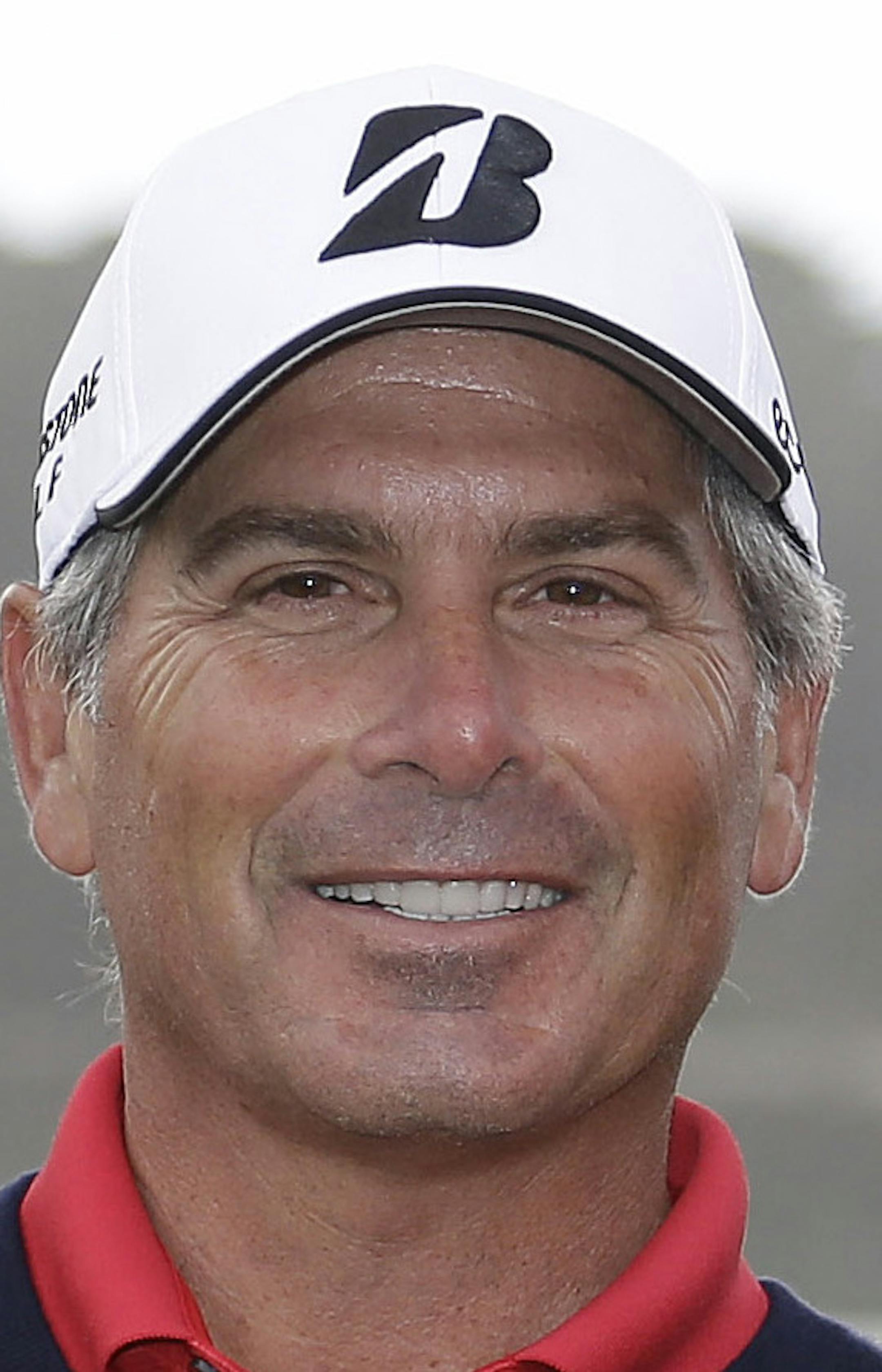 Fred Couples, left, and Kenny Perry, right, pose with their trophies on the 18th green after the final round of the Charles Schwab Cup Championship Champions Tour golf tournament Sunday, Nov. 3, 2013, in San Francisco. (AP Photo/Eric Risberg) ORG XMIT: CAER115