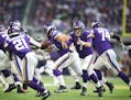 Minnesota Vikings quarterback Case Keenum (7) pitched the ball to running back Jerick McKinnon (21) in the first quarter at U.S. Bank Stadium Sunday D