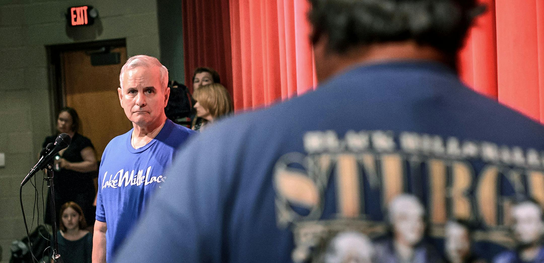 Jack Dunn is warned about speaking too long as residents speak to Gov. Mark Dayton about how the walleye crisis is effecting their lives and businesses at a town hall meeting Friday, July 31, 2015, in Isle, Minn. Dayton announced that Melanie Benjamin, chief executive of the Mille Lacs Band of Ojibwe, agreed her tribe would halt the netting of walleye on Mille Lacs Lake next year amid an effort to reduce the strain on one of the state's premier fisheries. (Glen Stubbe /Star Tribune via AP) MANDA