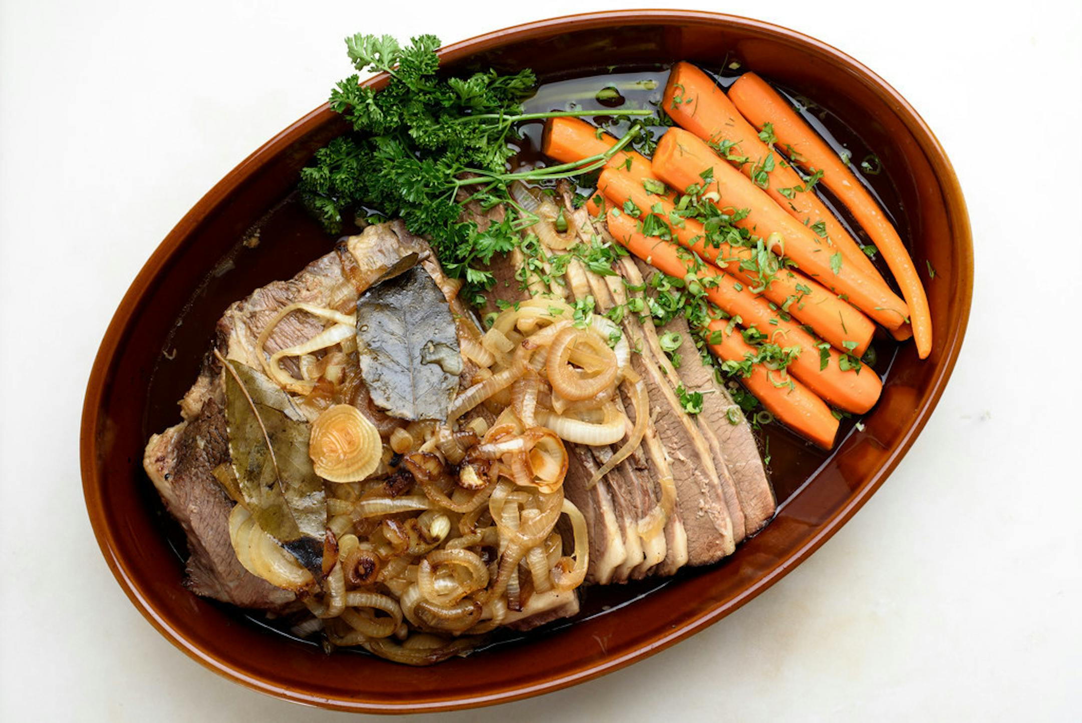 Classic beef brisket with caramelized onions and carrots.