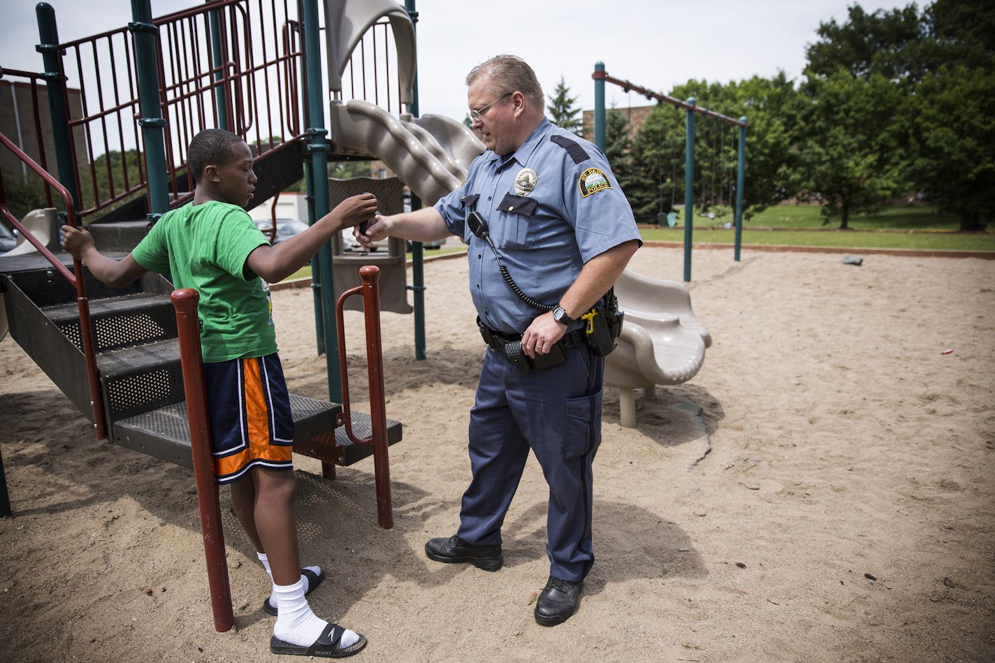 St. Paul police officer Rob Zink visited Devont'e Ray-Burns, 12, who has autism and other disabilities. Devont'e was afraid of police until meeting Zink.