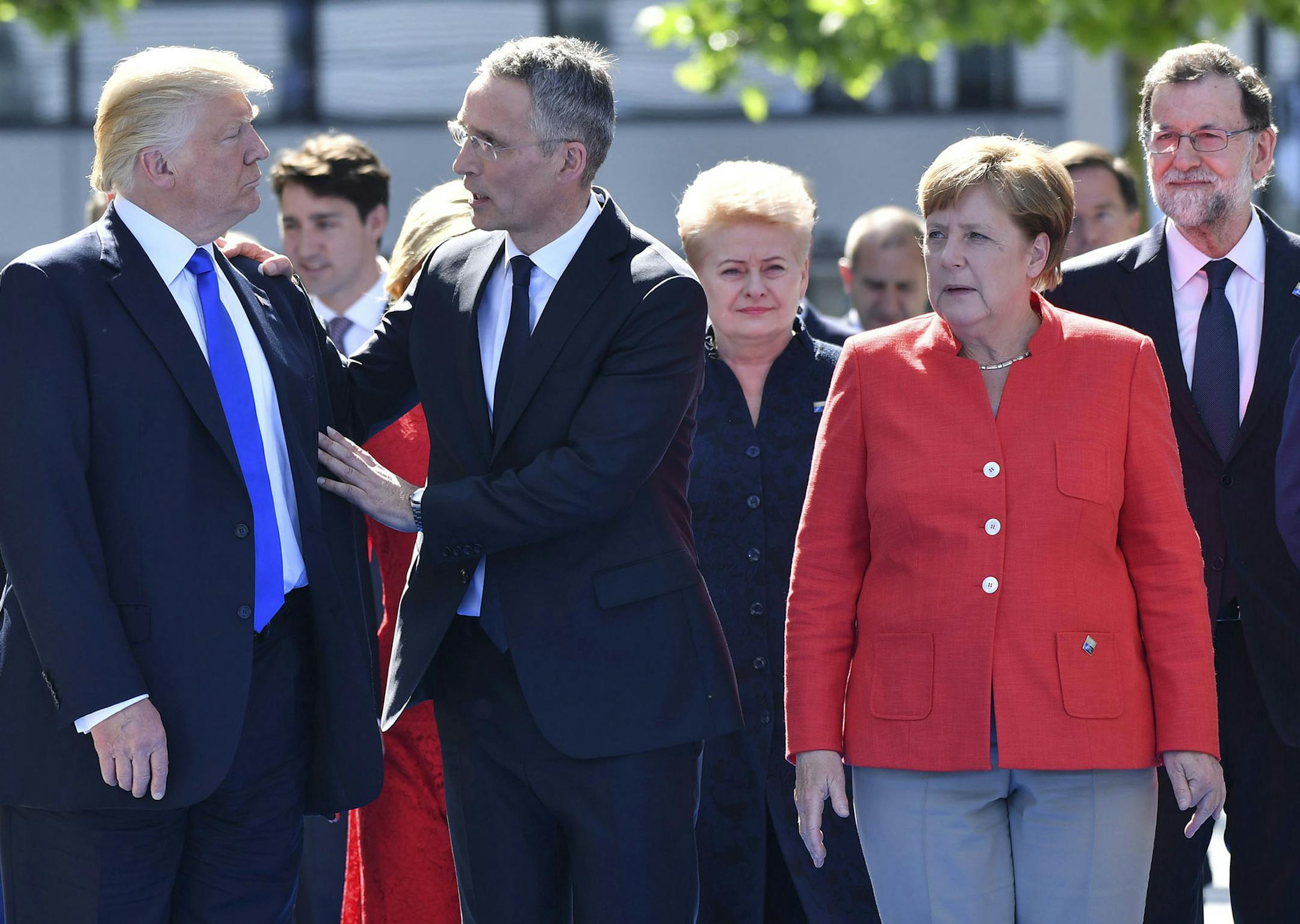 U.S. President Donald Trump, left, NATO Secretary General Jens Stoltenberg and German Chancellor Angela Merkel walk through NATO headquarters at the NATO summit in Brussels on Thursday, May 25, 2017. US President Donald Trump and other NATO heads of state and government on Thursday will inaugurate the new headquarters as well as participating in an official working dinner. (AP Photo/Geert Vanden Wijngaert) ORG XMIT: MIN2017053010495923