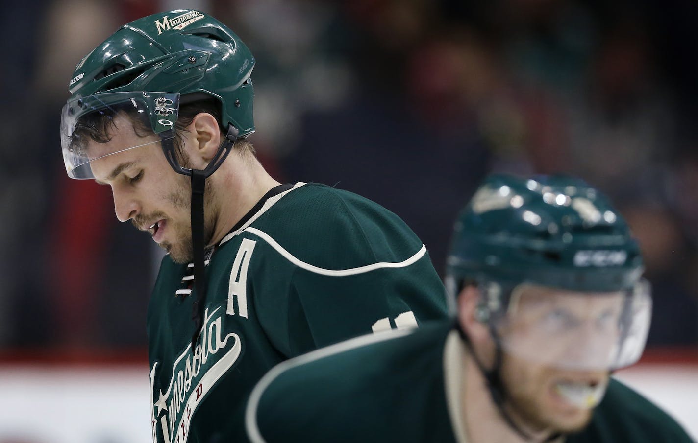 Zach Parise (11) and Mikko Koivu (9) skated off the ice at the end of the game. Chicago beat Minnesota by a final score of 1-0. ] CARLOS GONZALEZ cgonzalez@startribune.com, May 5, 2015, St. Paul, MN, Xcel Energy Center, NHL, Minnesota Wild vs. Chicago Blackhawks, Game 3, Stanley Cup Playoffs, Round 2